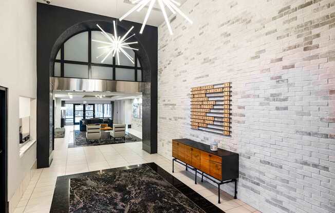 A modern living room with a black and white color scheme.