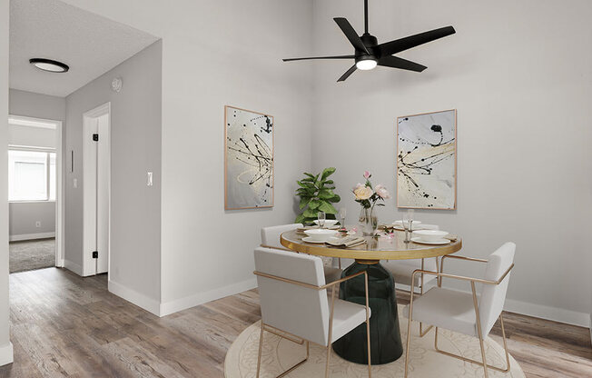 Hardwood floored dining room with view of second bedroom.