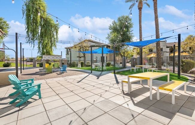 a large patio with picnic tables and chairs at Biscayne Bay