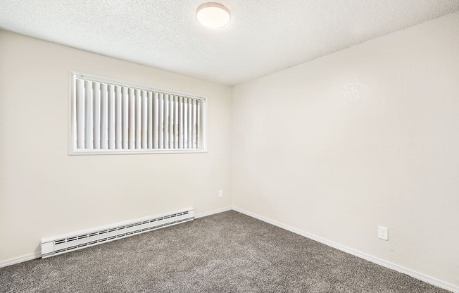 a bedroom with a window and carpet at Wildflower, Kennewick, 99336