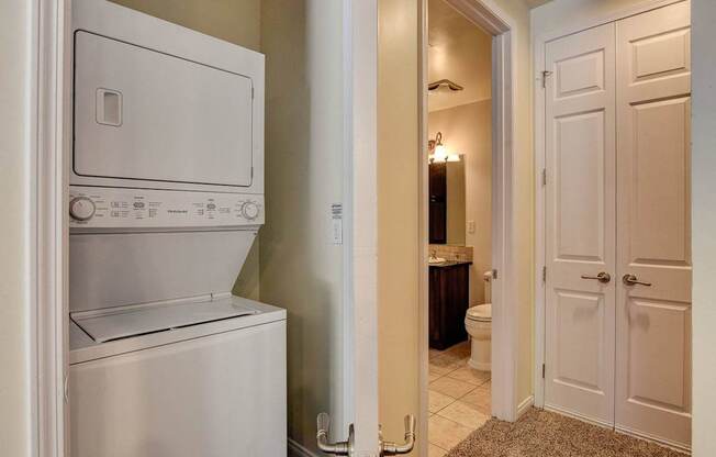A white oven and dishwasher in a kitchen.