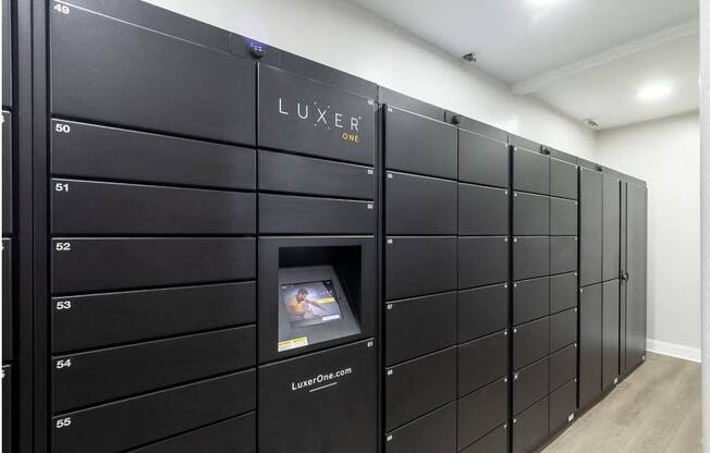 a bunch of lockers in a room with an oven in it