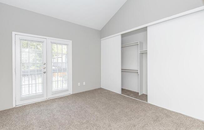 a bedroom with a large window