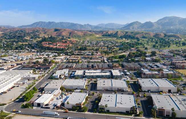 arial view of a city with mountains in the background at Loma Villas Apartments, California