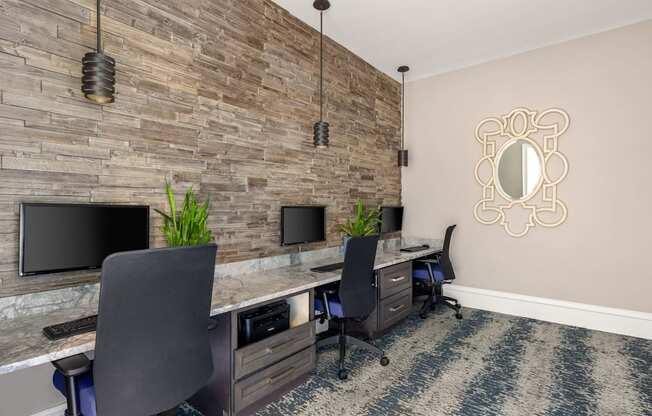 A room with a stone wall and a mirror on the wall.