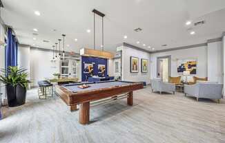 Cozy seating area in a resident lounge with modern decor at Allusion at West University apartments in Houston, TX