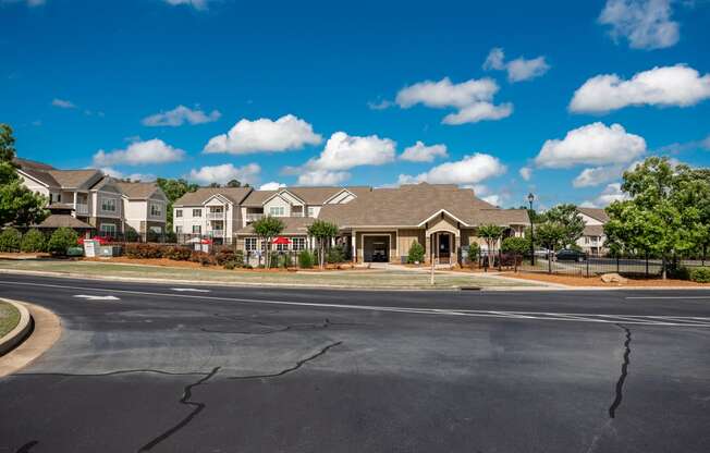 Resident clubhouse, leasing center, and pool area at Riverstone apartments for rent