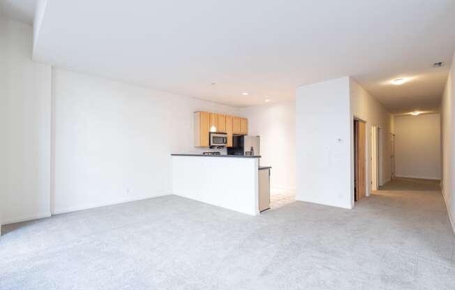 a kitchen and living room in an apartment at 26 West, Managed by Buckingham Urban Living, Indianapolis