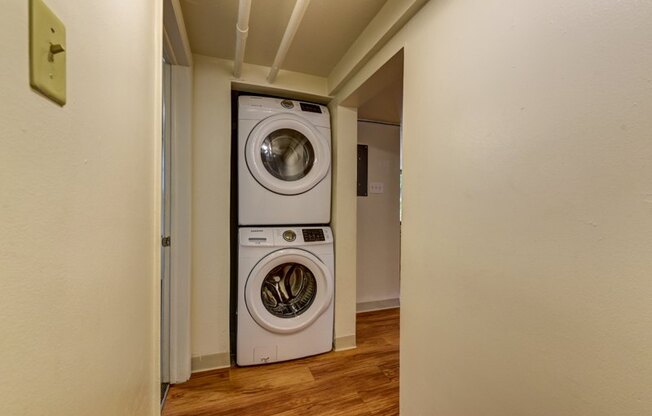 a washer and dryer in a room with a door