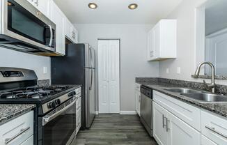 a kitchen with a stove top oven