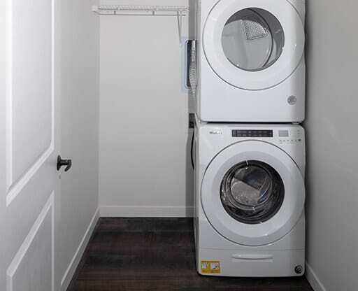 a washer and dryer in a small laundry room at The Landing at 1001 NP, Fargo, ND 58102