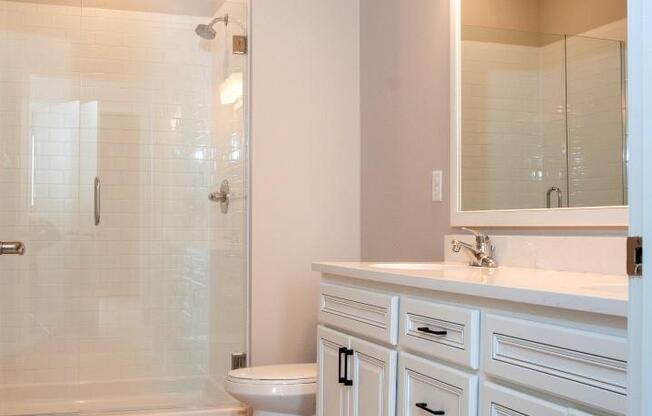 Bathrooms with Glass-Enclosed Showers at Residences at 1700, Minnetonka, MN