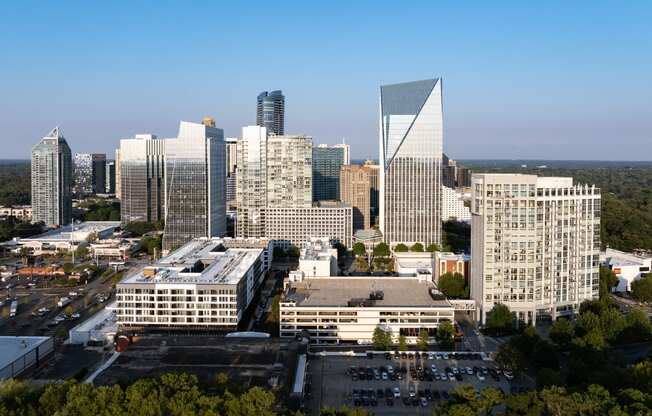 an aerial view of a city skyline with tall buildings and skyscrapers