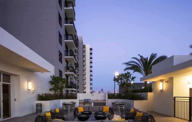 Balcony seating at night outside Miami Florida apartments.