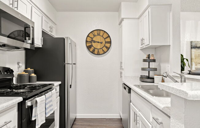 a kitchen with a stove and a sink