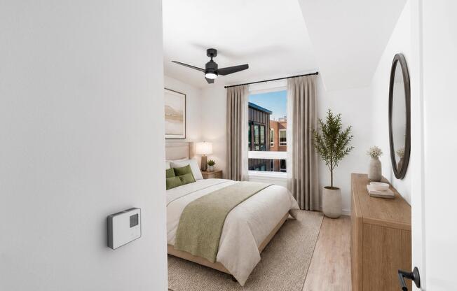 Comfortable bedrooms feature oversized windows, ceiling fans, and contemporary finishes designed to create a bright and relaxing retreat.