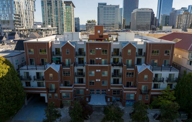 A large red brick building with a courtyard in the middle.