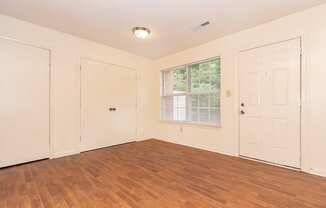 Living room with overhead lighting at Greens of Pine Glen in Durham NC