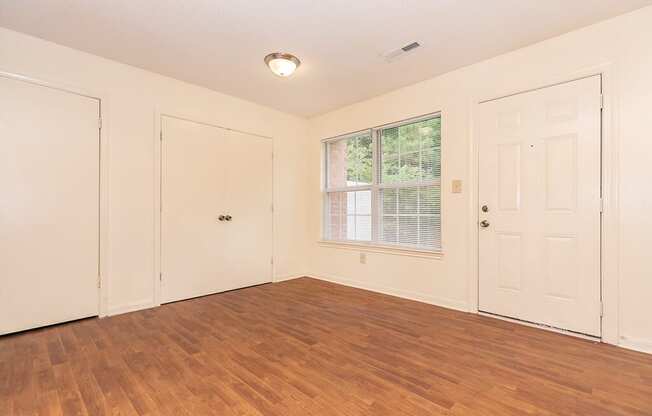 Living room with overhead lighting at Greens of Pine Glen in Durham NC
