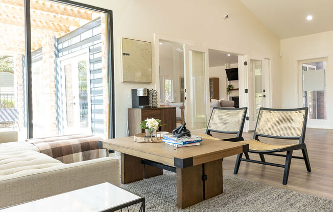 a living room filled with furniture and a large window at Sunset Canyon, San Antonio, TX