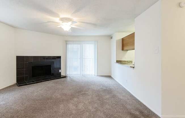 This is a photo of the living room in the 1245 square foot 2 bedroom, 2 bath apartment at Cambridge Court Apartments in Dallas, TX.