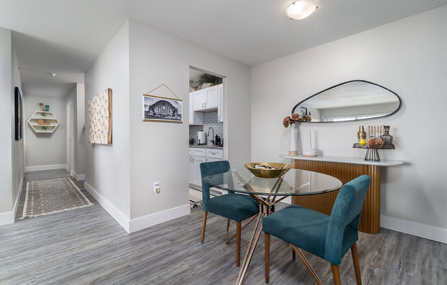 a dining room with a glass table and chairs at The Heights Apartments, Ohio, 45220