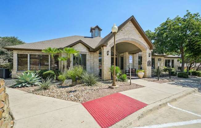 A house with a red mat in front of it.