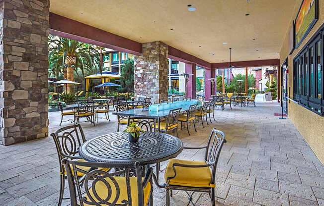 A patio with tables and chairs is shown.