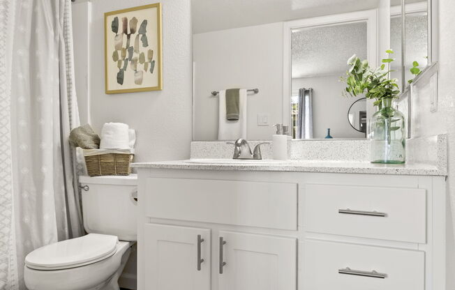 a kitchen with a sink and a mirror