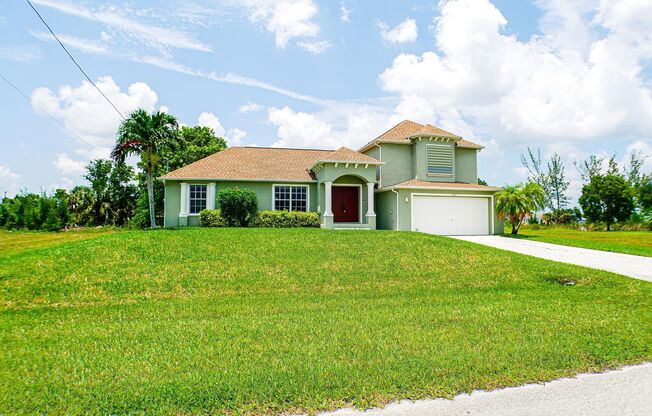 Beautiful 3 beds 2 bath 2-story home overviewing the canal in Cape Coral