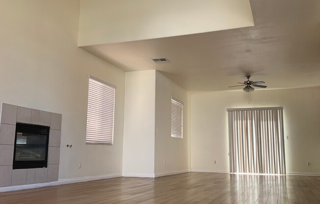 Two story home in gated community with community pool, featuring 4 bedrooms including one bedroom downstairs with a private bathroom! Home has a large great room with high ceilings that's visible from the second floor! Open kitchen with granite countertop