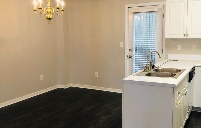 Close to Downtown Greer - this is a Fantastic 2 Bedroom, 2.5 Bathroom end unit condo that offers tons of storage and open space.