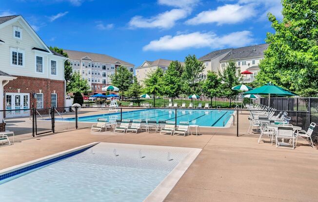 our apartments have a resort style pool with chairs and tables