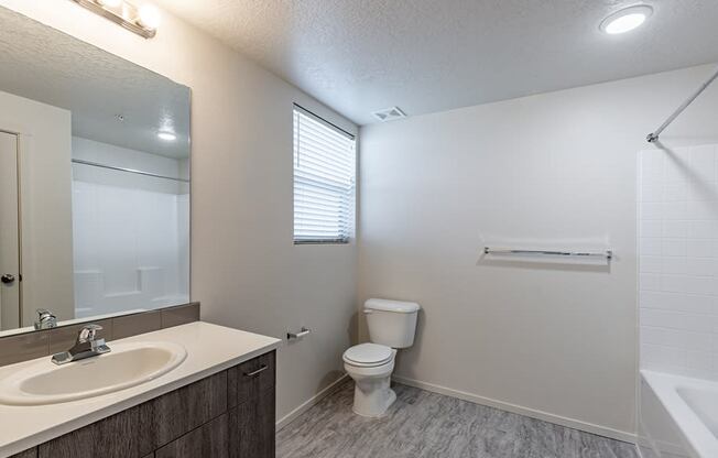 a bathroom with a toilet sink and bathtub