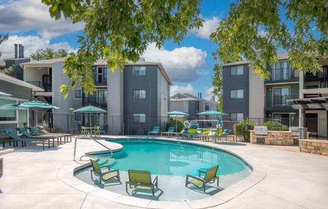 our apartments offer a swimming pool with chairs and umbrellas