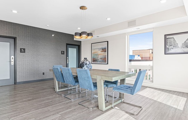 a dining room with a table and chairs
