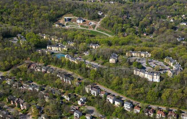 a aerial view of a neighborhood with houses and trees