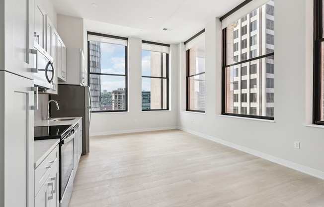 A spacious kitchen with a view of the city.