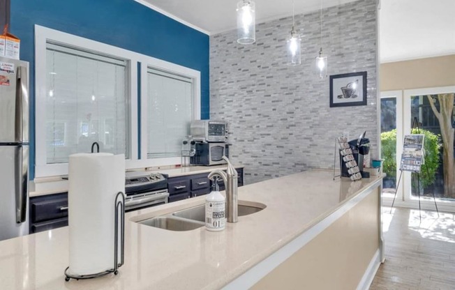 a kitchen with a counter top and a sink