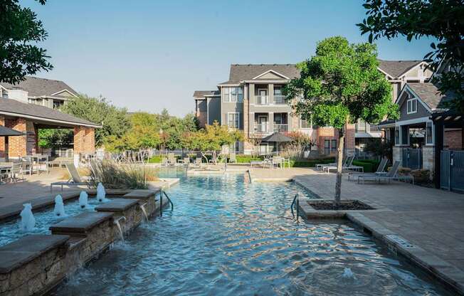 a swimming pool with a building in the background