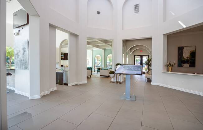 Leasing office lobby with tall walls and a greeting area