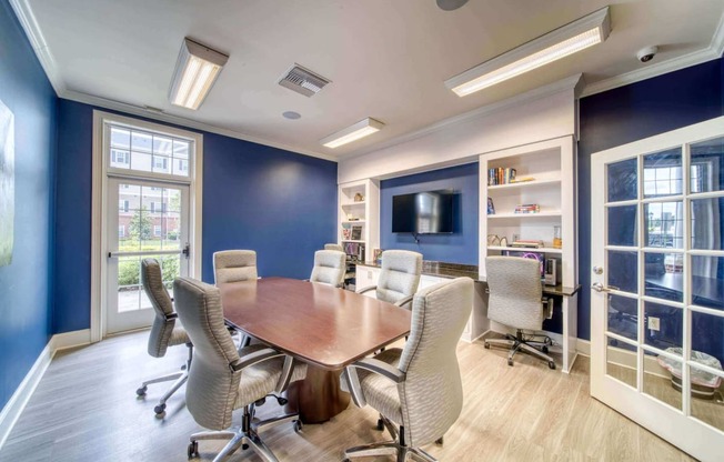 a meeting room with a table and chairs at Meridian Obici, Virginia, 23434