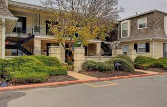 Exterior image of Deauville apartments with trees and bushes