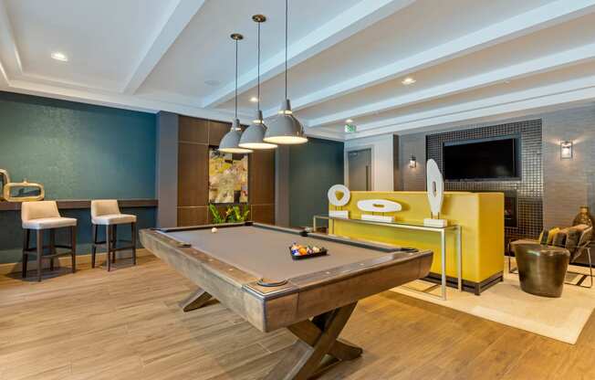 clubroom with pool table and seating at 1010 Dilworth Apartments, Charlotte, NC