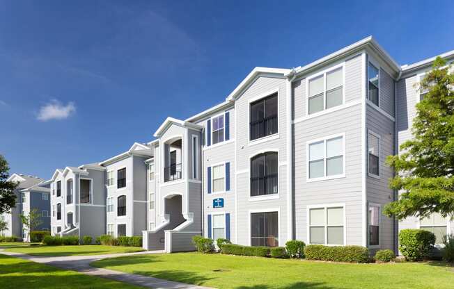 Courtney Station Apartments - Building exterior with manicured lawn