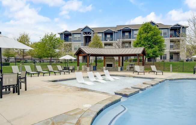 the preserve at ballantyne commons pool and spa with apartment buildings in the background