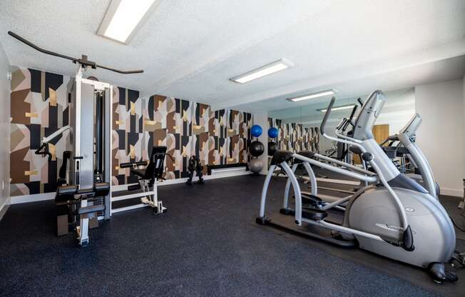 a gym with treadmills and other exercise equipment at Campbell West Apartments, Campbell