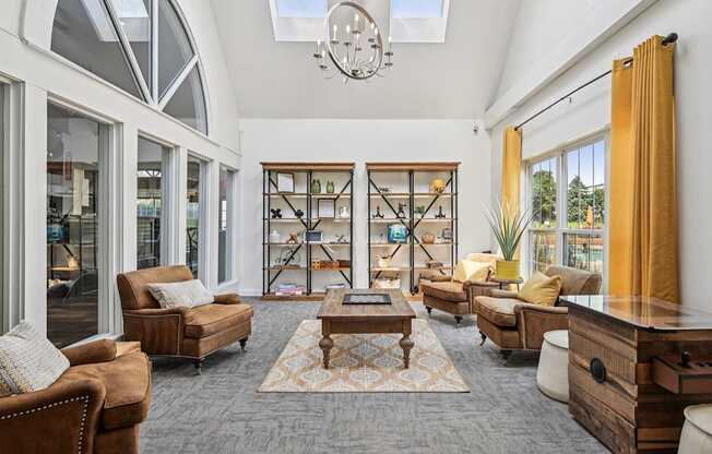 A living room with a brown sofa and a wooden coffee table.