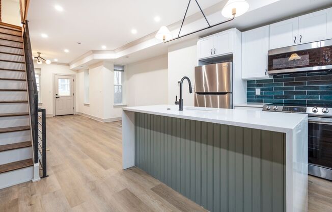 Welcome home to this newly renovated porch front on great west Philly block!