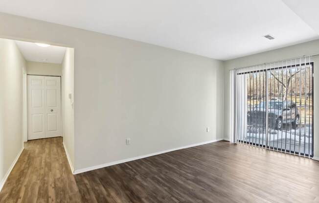 A room with wooden floors and white walls.